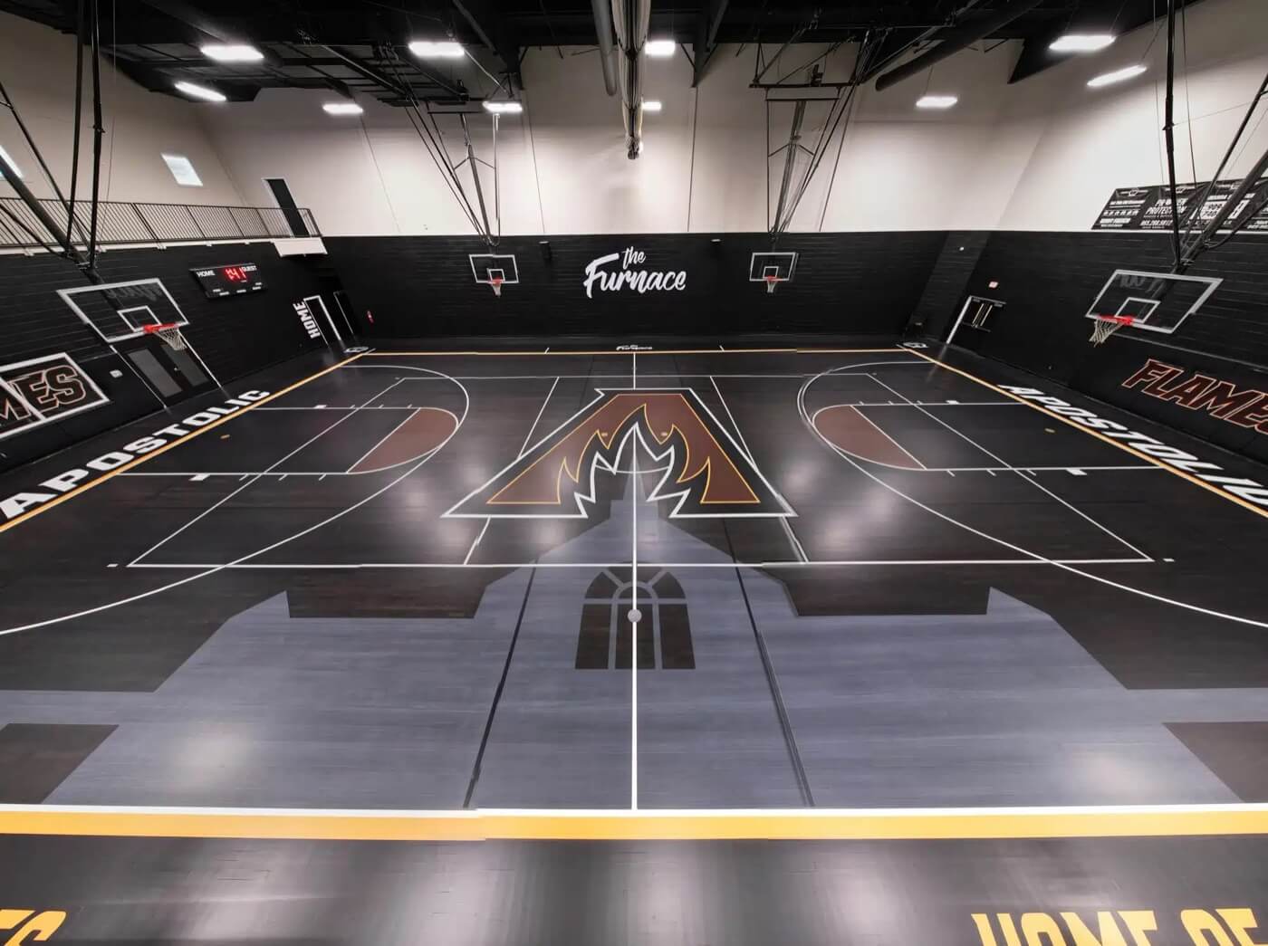 ACA's gym, The Furnace, with the Flames logo at center court